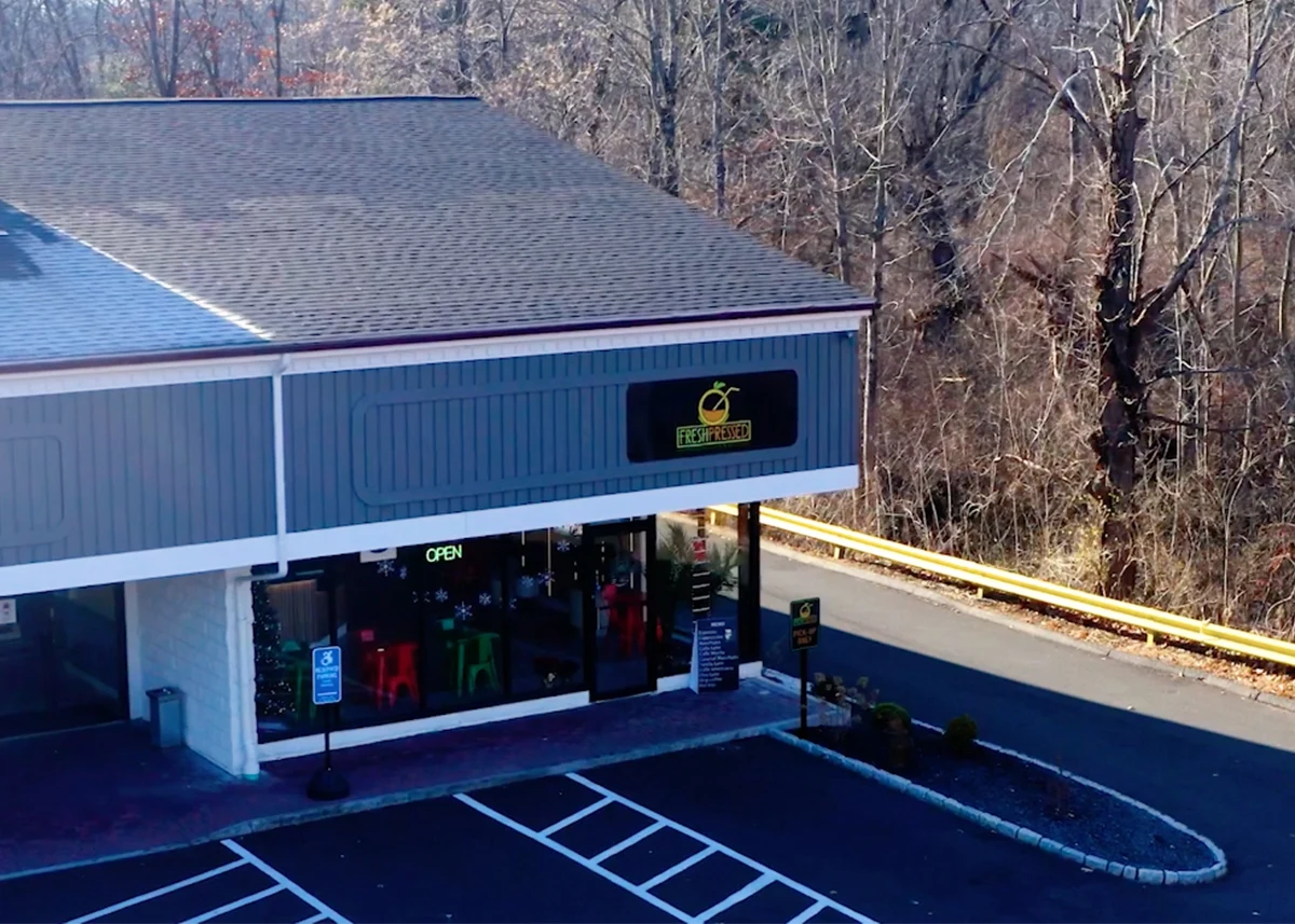 Fresh Pressed storefront and parking in Plantsville